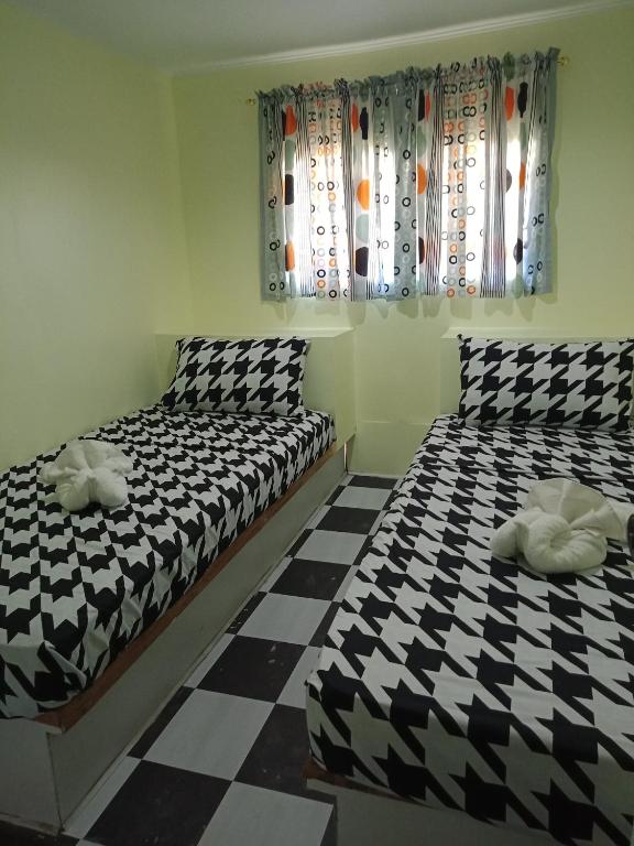 Postel nebo postele na pokoji v ubytování Ander Divers Garden Resort