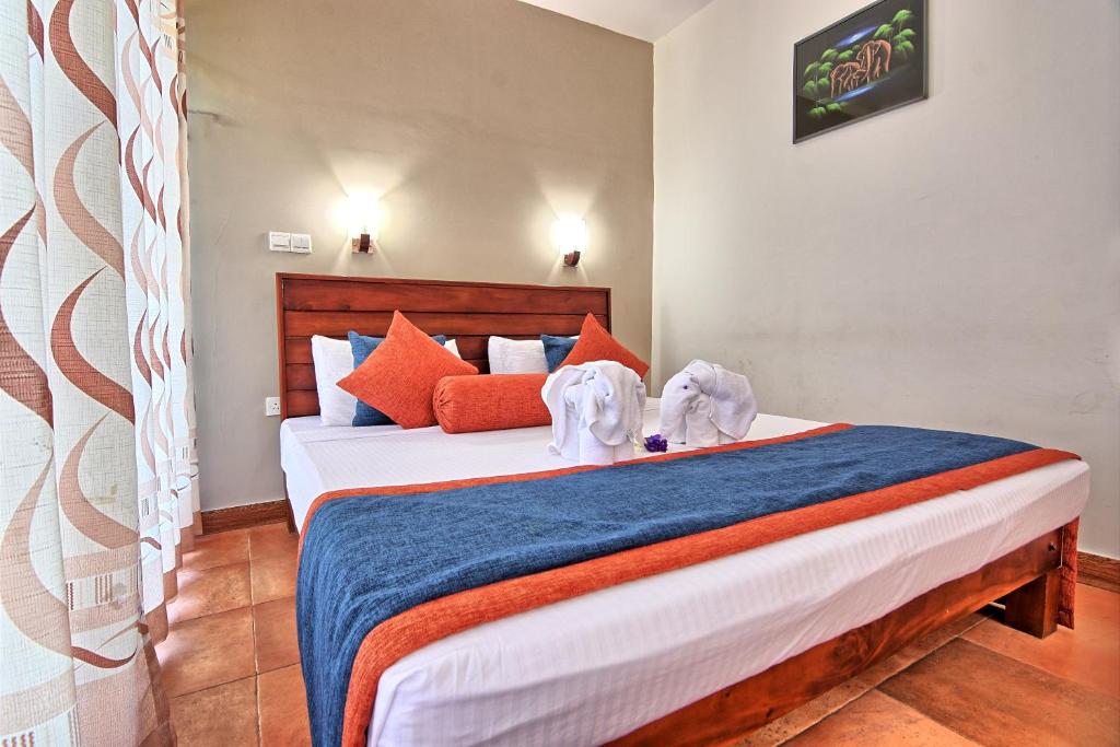 Postel nebo postele na pokoji v ubytování Oak Ray Ella Gap Hotel