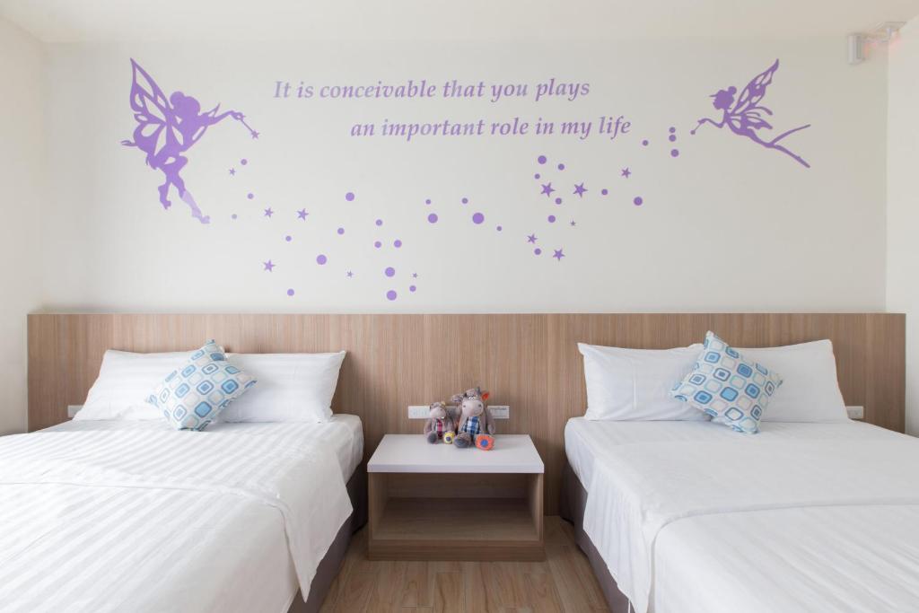 Postel nebo postele na pokoji v ubytování Sanwu Homestay