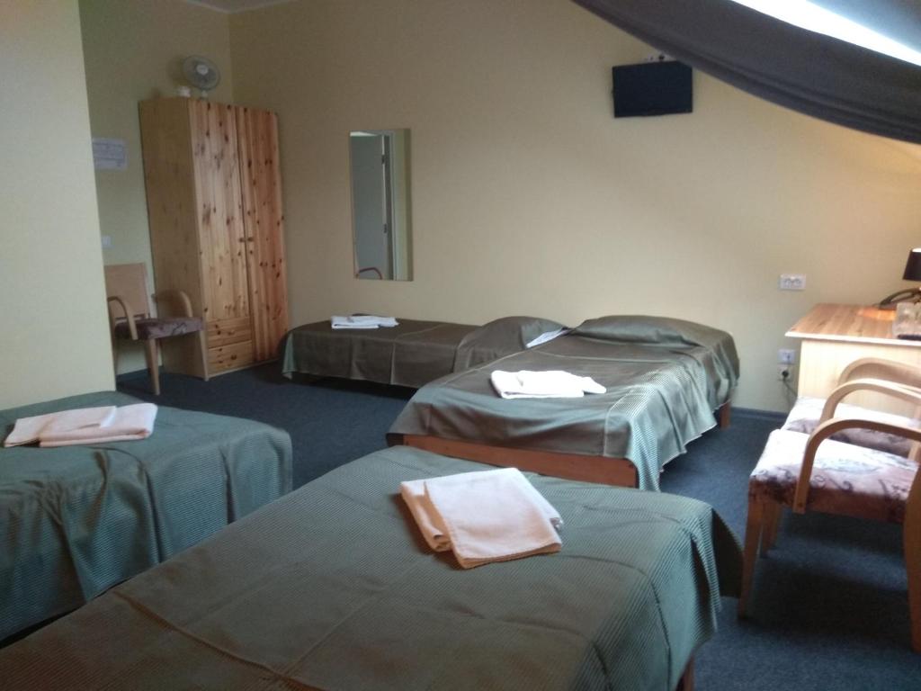 Postel nebo postele na pokoji v ubytování Alex Hotel