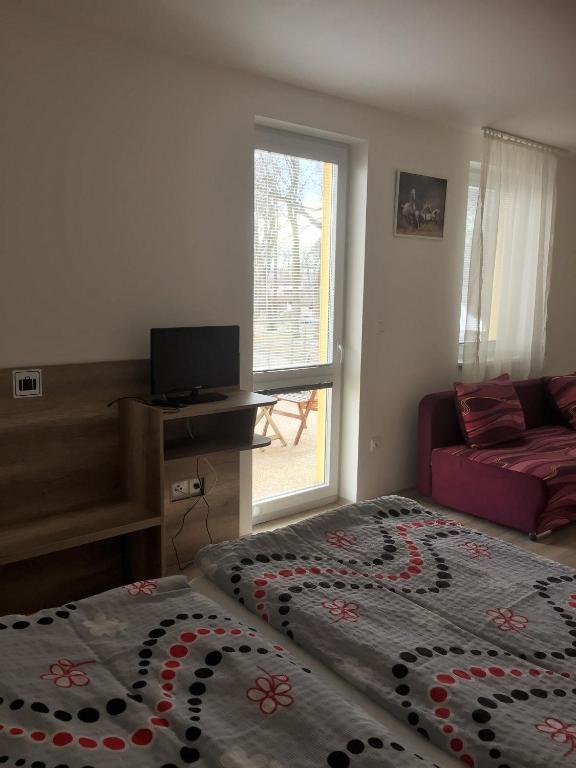 Postel nebo postele na pokoji v ubytování Promenád apartmány