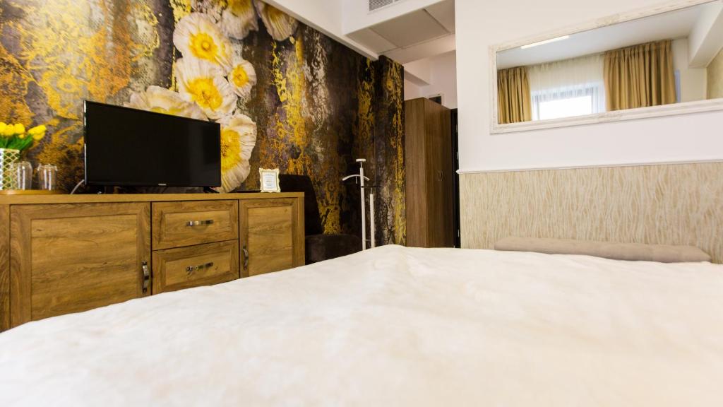 Postel nebo postele na pokoji v ubytování Hotel Evianne Boutique