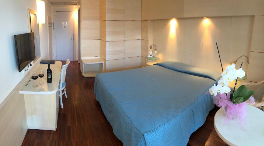 Postel nebo postele na pokoji v ubytování Park Hotel Il Vigneto