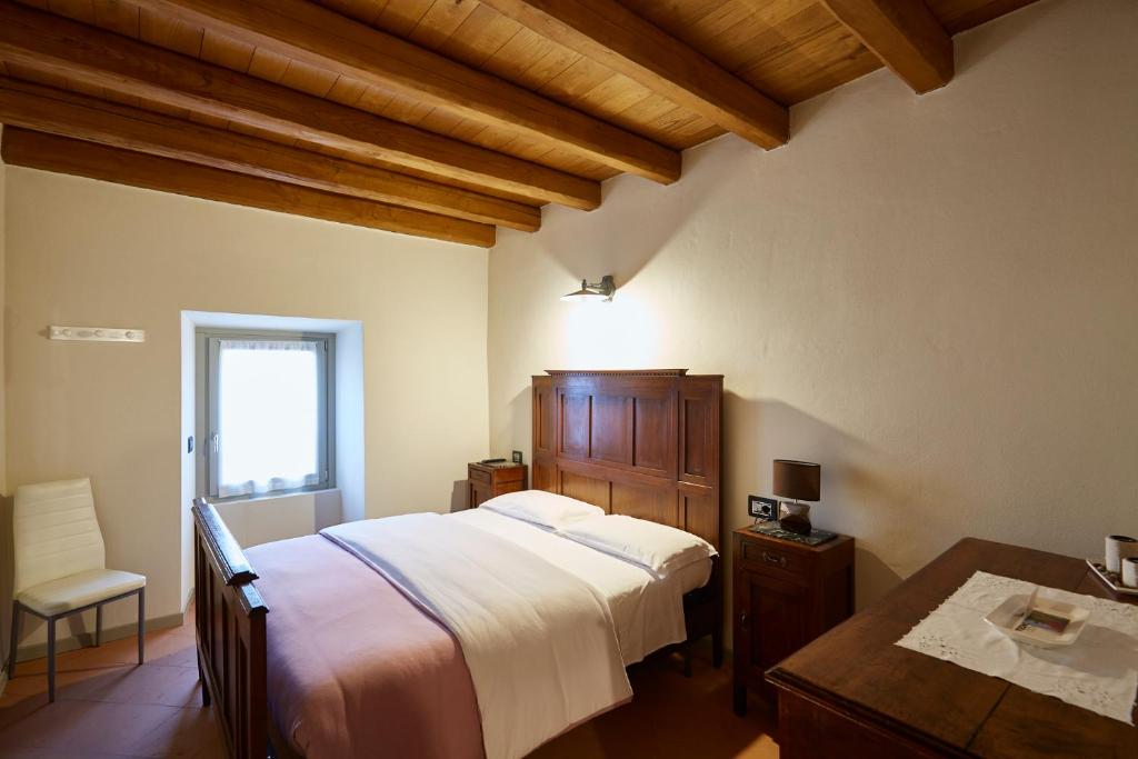 Postel nebo postele na pokoji v ubytování Palazzo Eleonora