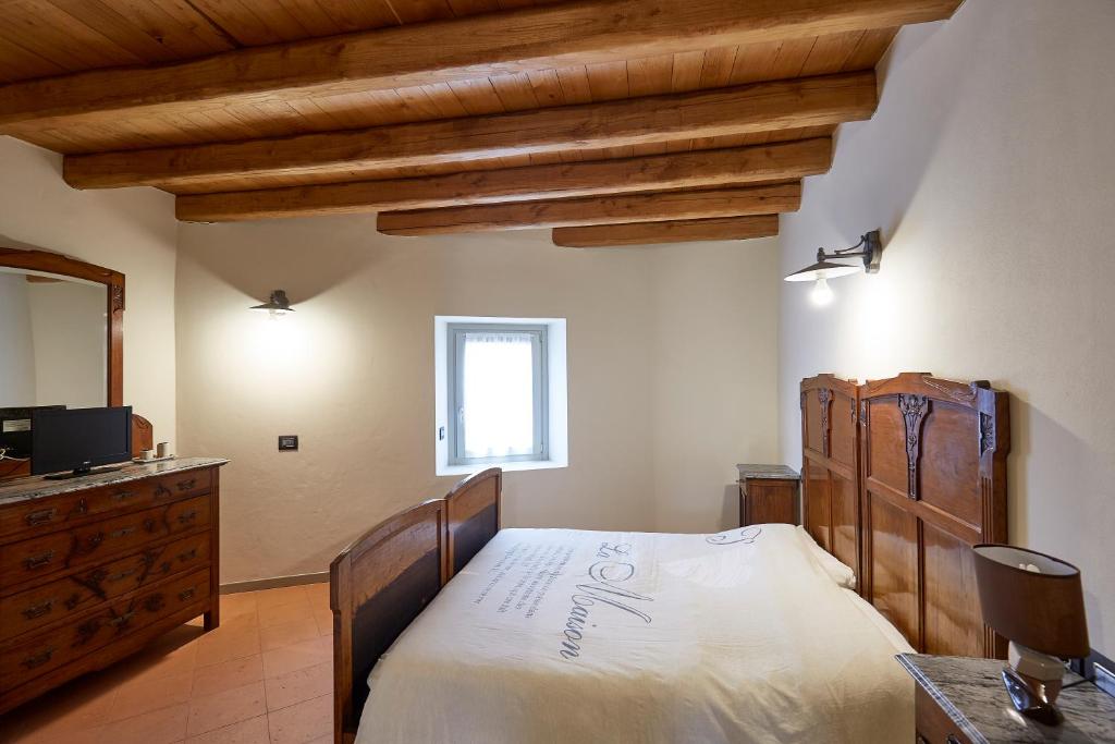 Postel nebo postele na pokoji v ubytování Palazzo Eleonora