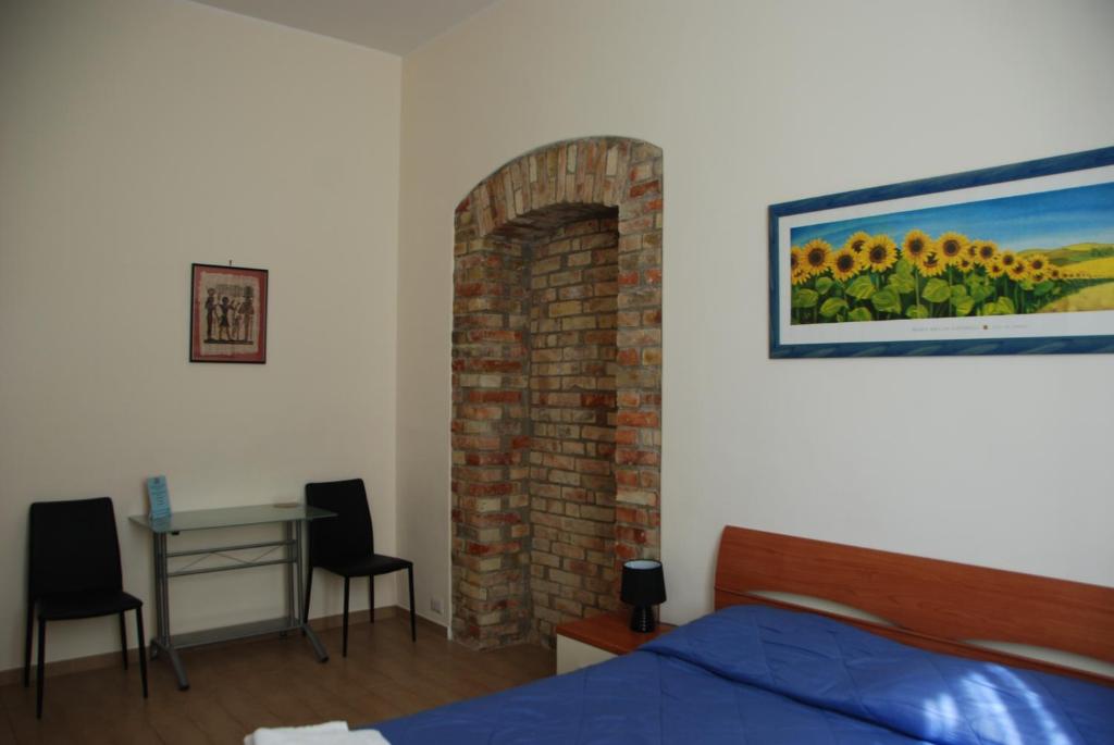 Postel nebo postele na pokoji v ubytování Le Due Nicchie