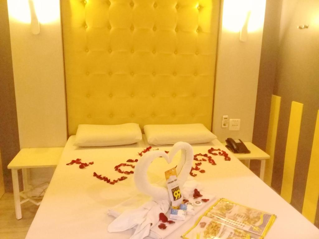 Postel nebo postele na pokoji v ubytování Hotel 99 Monumento