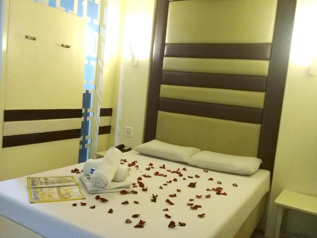 Postel nebo postele na pokoji v ubytování Hotel 99 Monumento