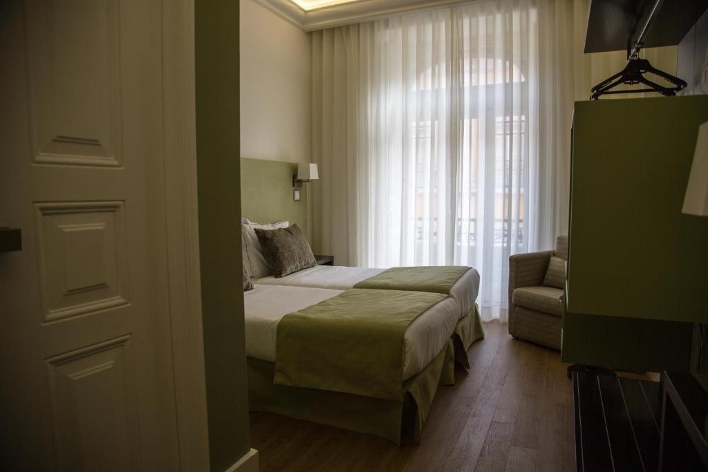 En eller flere senger på et rom på Hotel Dublin