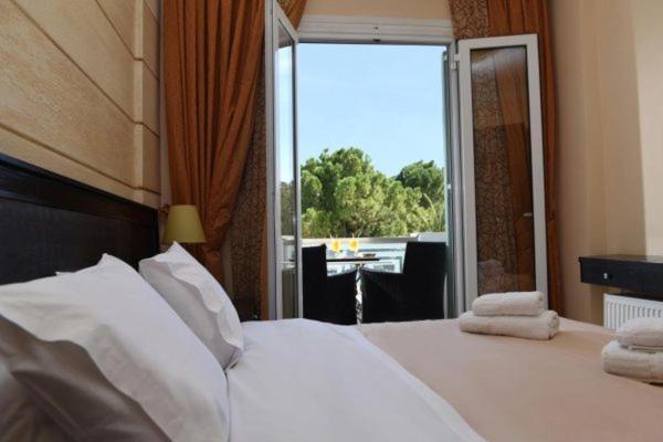 Postel nebo postele na pokoji v ubytování Aktis Hotel
