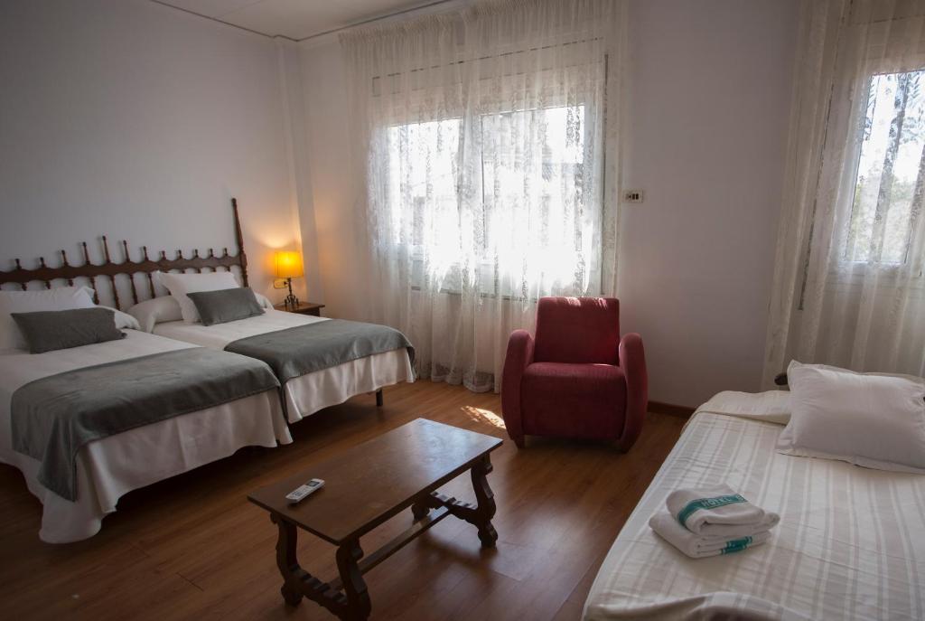 Postel nebo postele na pokoji v ubytování Hotel Segle XX