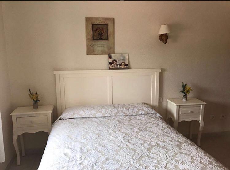 Postel nebo postele na pokoji v ubytování Hostal Restaurante Puerto Blanco