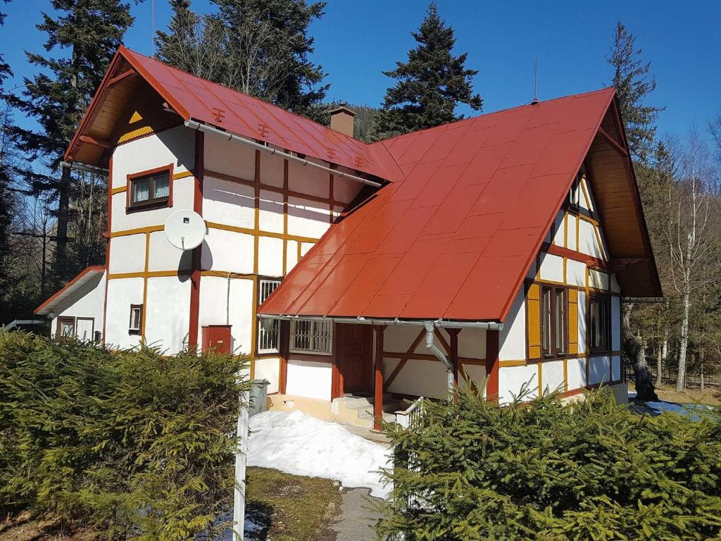 a house with a red roof at Vila Zdenka in Vysoke Tatry - Tatranska Kotlina