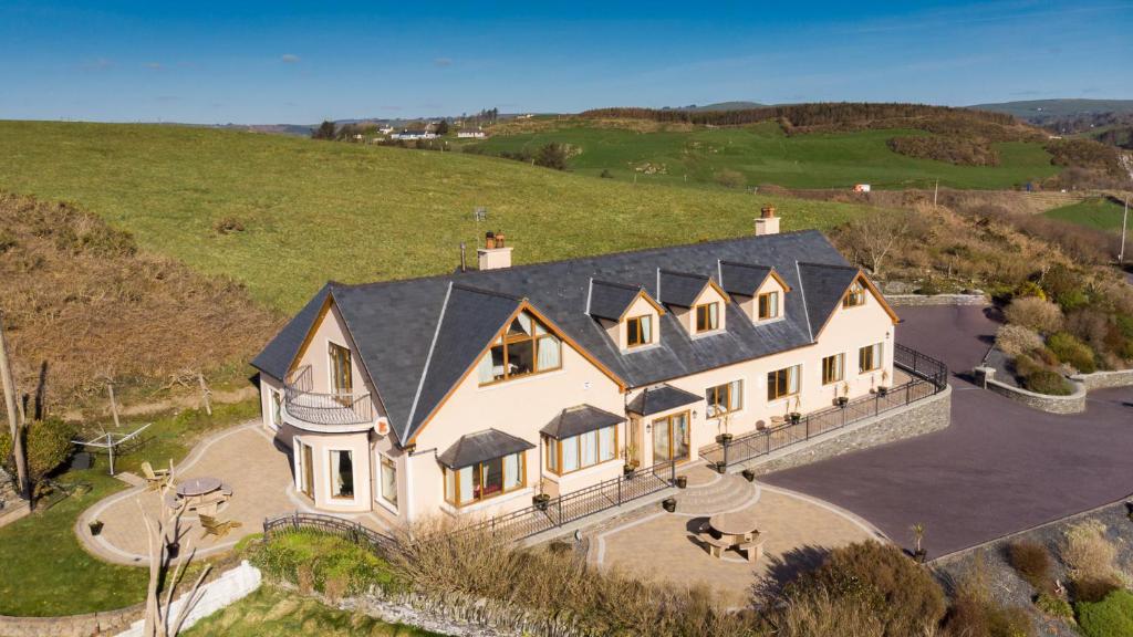 an aerial view of a large house on a hill at Bethel Guesthouse in Rosscarbery