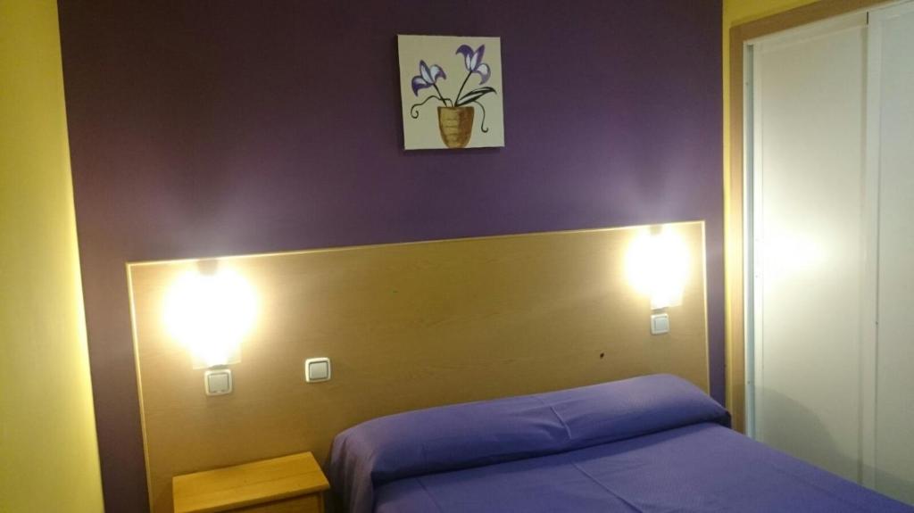Postel nebo postele na pokoji v ubytování Hostal DS