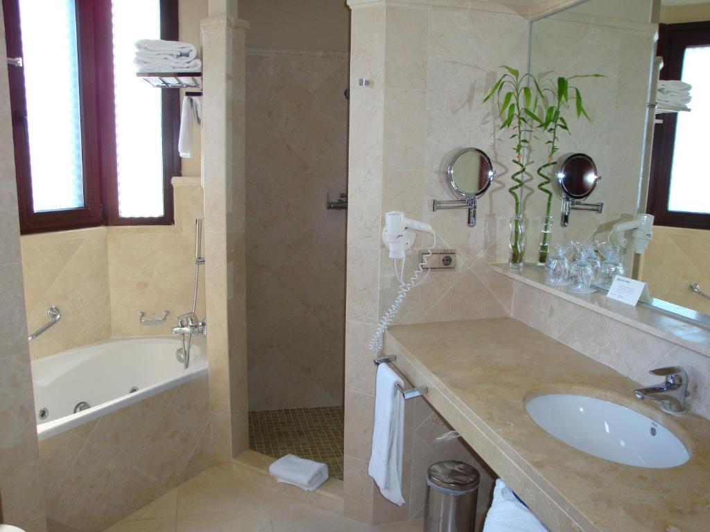 a bathroom with a tub and a sink and a bath tub at SH Villa Gadea in Altea