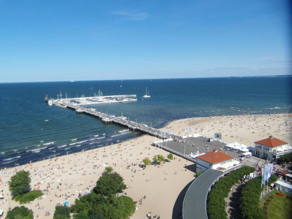 an aerial view of a beach with a pier at Iwona Hostel - Budget Rooms with Private Bathrooms in Sopot