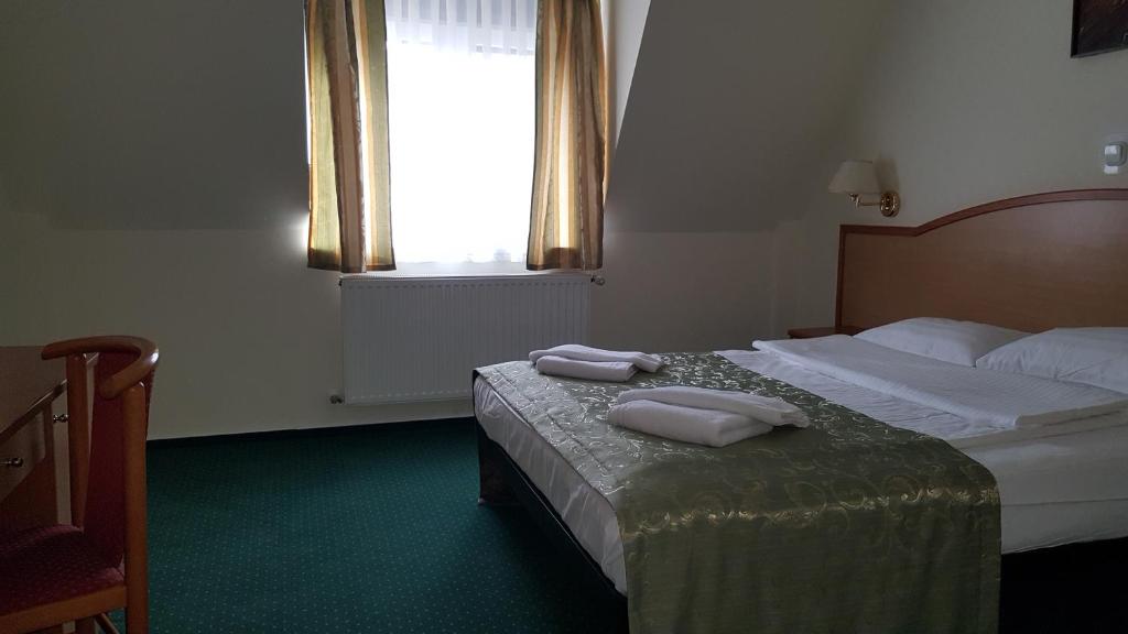 Postel nebo postele na pokoji v ubytování Hotel Melody