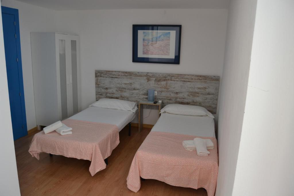 Posteľ alebo postele v izbe v ubytovaní Hotel Boutique Nomadas