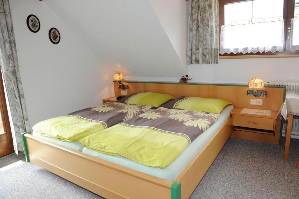 A bed or beds in a room at Haus Dorfer