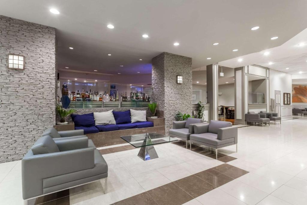 a lobby with couches and chairs in a building at Wyndham Southbury in Southbury