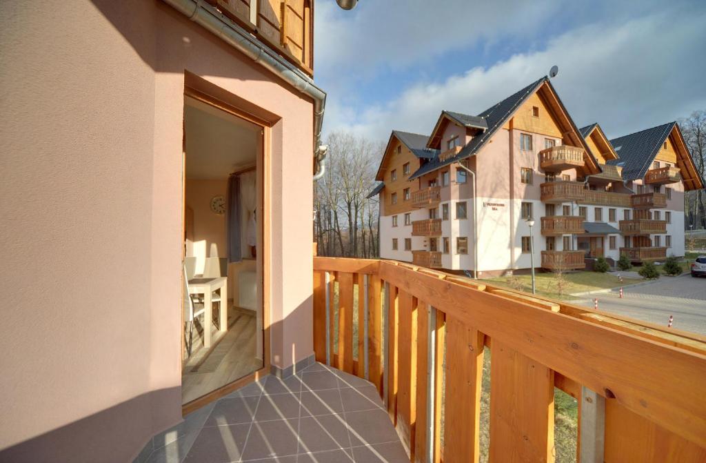 a balcony with a view of a building at Apartamenty "MILENA" in Karpacz