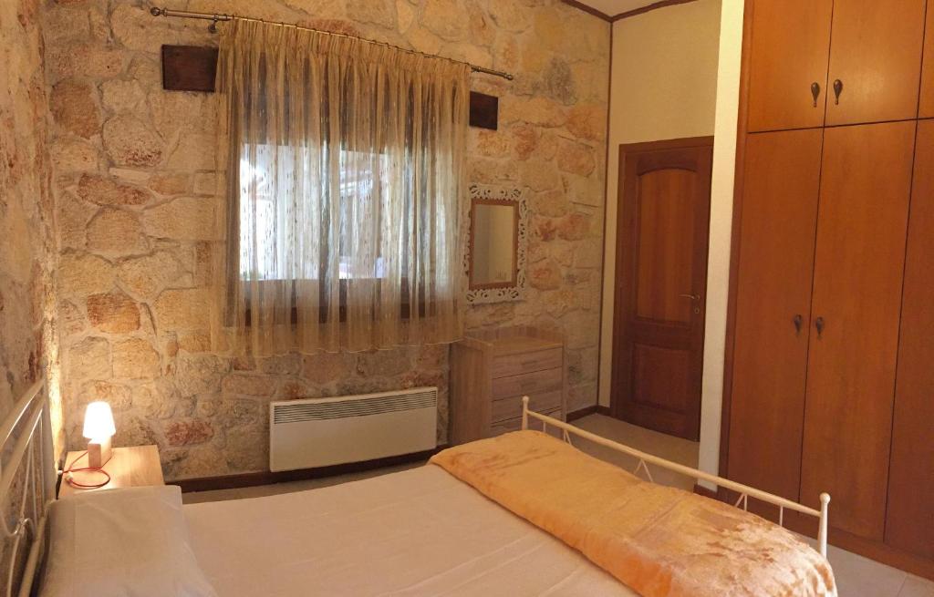 Postel nebo postele na pokoji v ubytování Rahona Villas