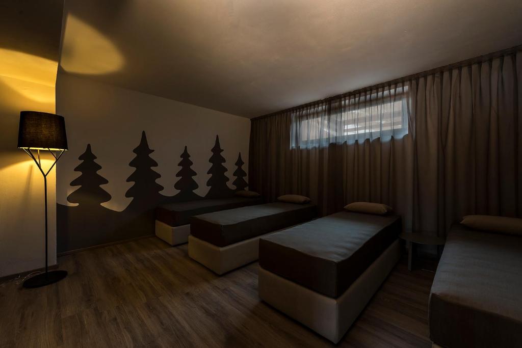 Postel nebo postele na pokoji v ubytování Chalet Aster