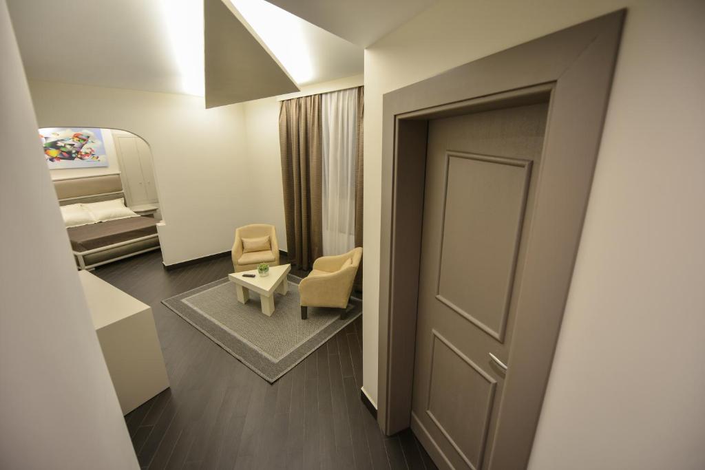 Uma cama ou camas num quarto em Petit Hotel Elita