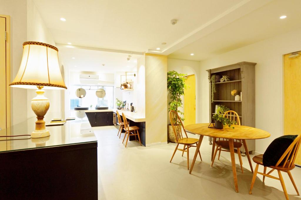 a kitchen and dining room with a table and chairs at nid Osaka TENNOJI in Osaka