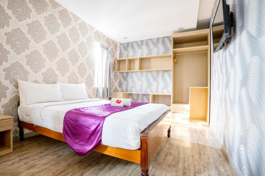 Postel nebo postele na pokoji v ubytování White Residence Hotel & Apartment