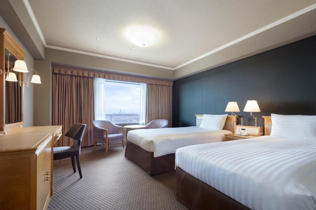 Postel nebo postele na pokoji v ubytování Hotel Agora Regency Osaka Sakai