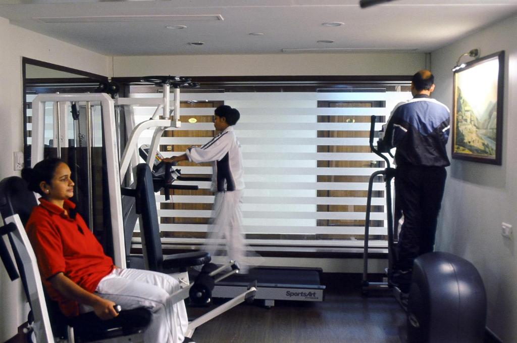 a group of three men in a gym at Namah Nainital, a member of Radisson Individuals Retreats in Nainital