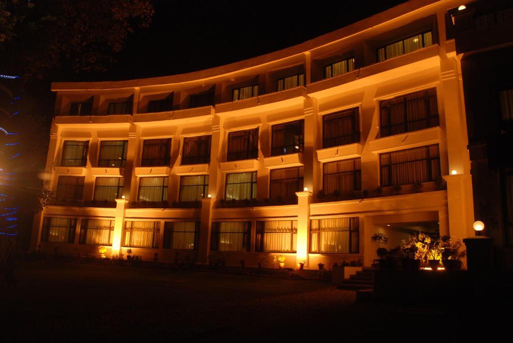 a large building at night with lights on it at Namah Nainital, a member of Radisson Individuals Retreats in Nainital
