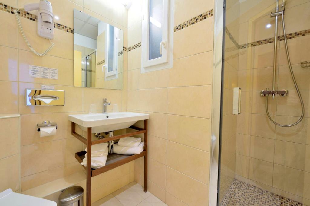 Koupelna v ubytování Hotel Capitole