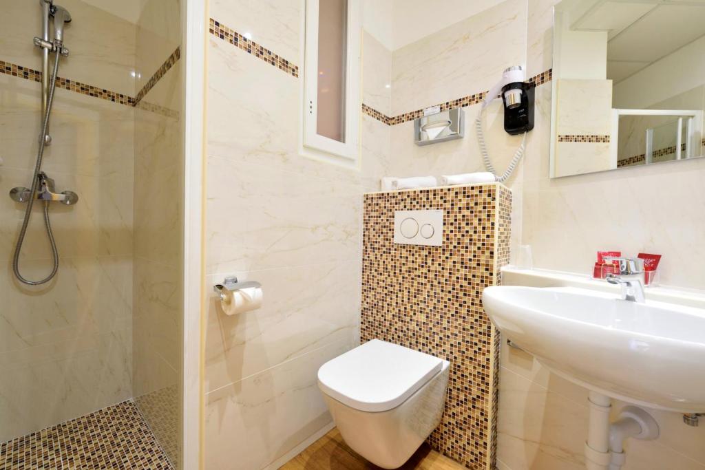 Koupelna v ubytování Hotel Capitole