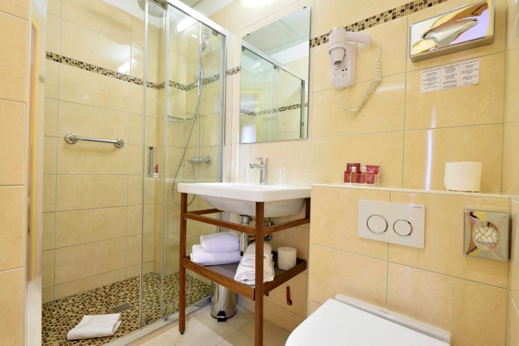 Koupelna v ubytování Hotel Capitole