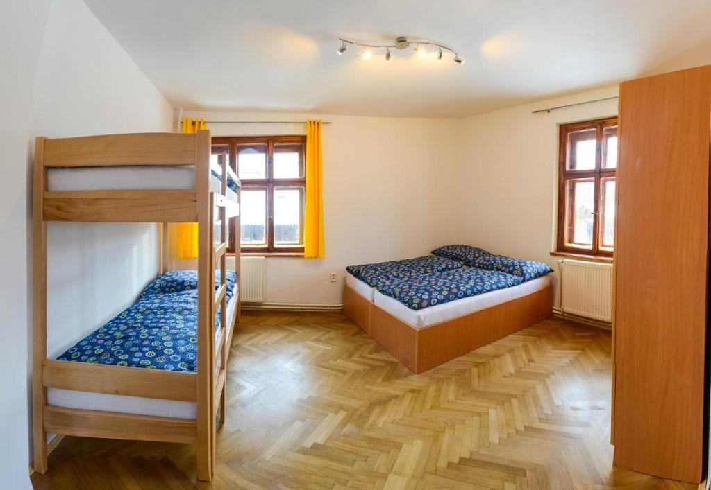Postel nebo postele na pokoji v ubytování Apartmány pod klášterem