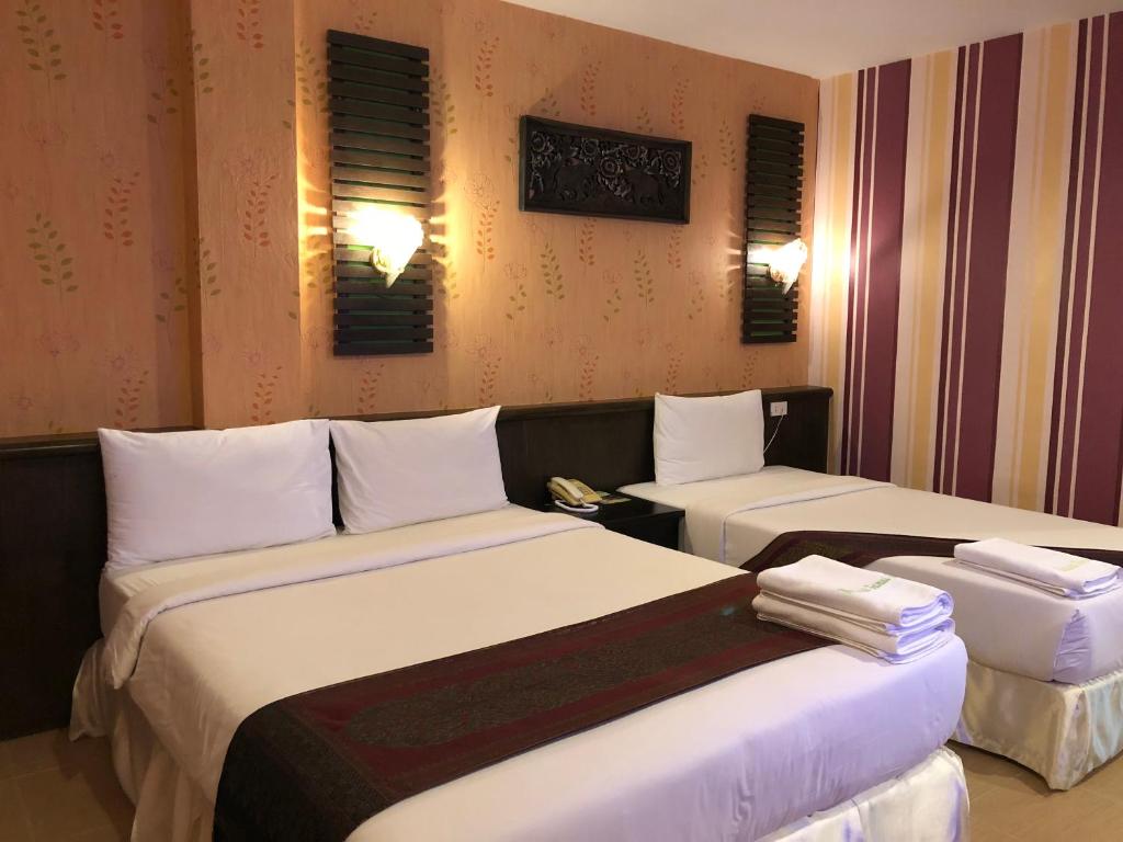 Postel nebo postele na pokoji v ubytování Natural Samui Hotel