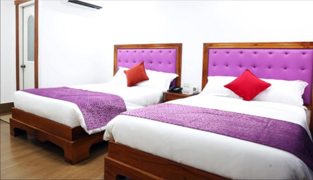 Postel nebo postele na pokoji v ubytování CLN Boutique Hotel