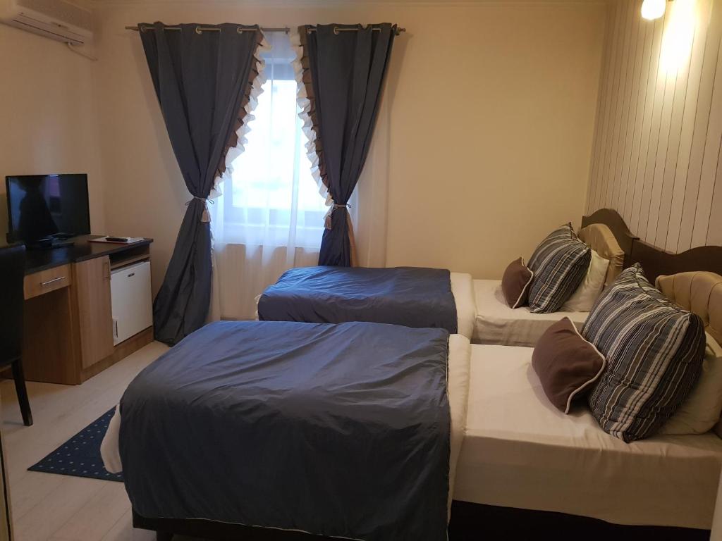 Postel nebo postele na pokoji v ubytování Boutique Vila Paradis