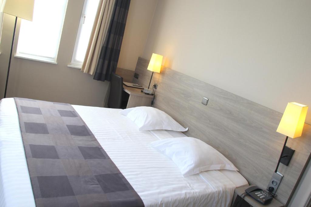 Postel nebo postele na pokoji v ubytování Arriate Hotel