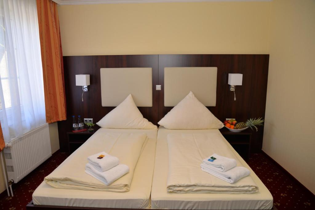 Postel nebo postele na pokoji v ubytování Hotel Neugrabener Hof