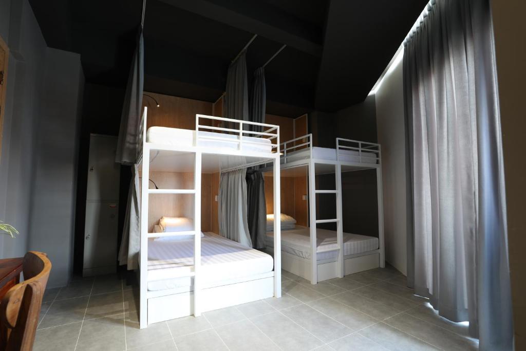 Postel nebo postele na pokoji v ubytování RS II Guesthouse