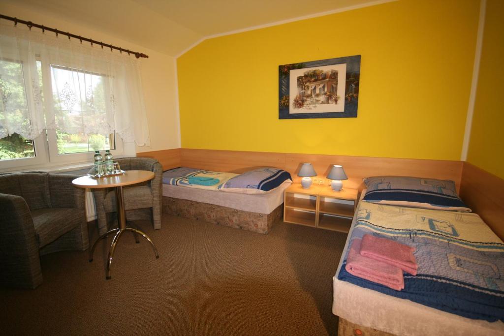 Postel nebo postele na pokoji v ubytování H+M Penzion