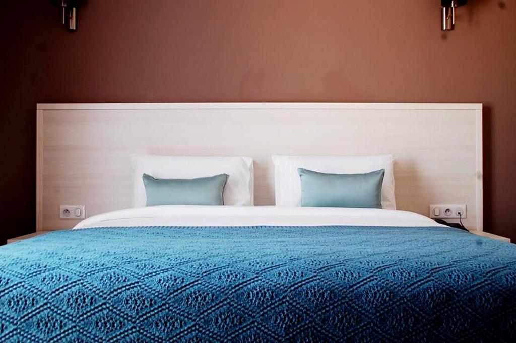 Postel nebo postele na pokoji v ubytování Le Zenith Hotel Oran