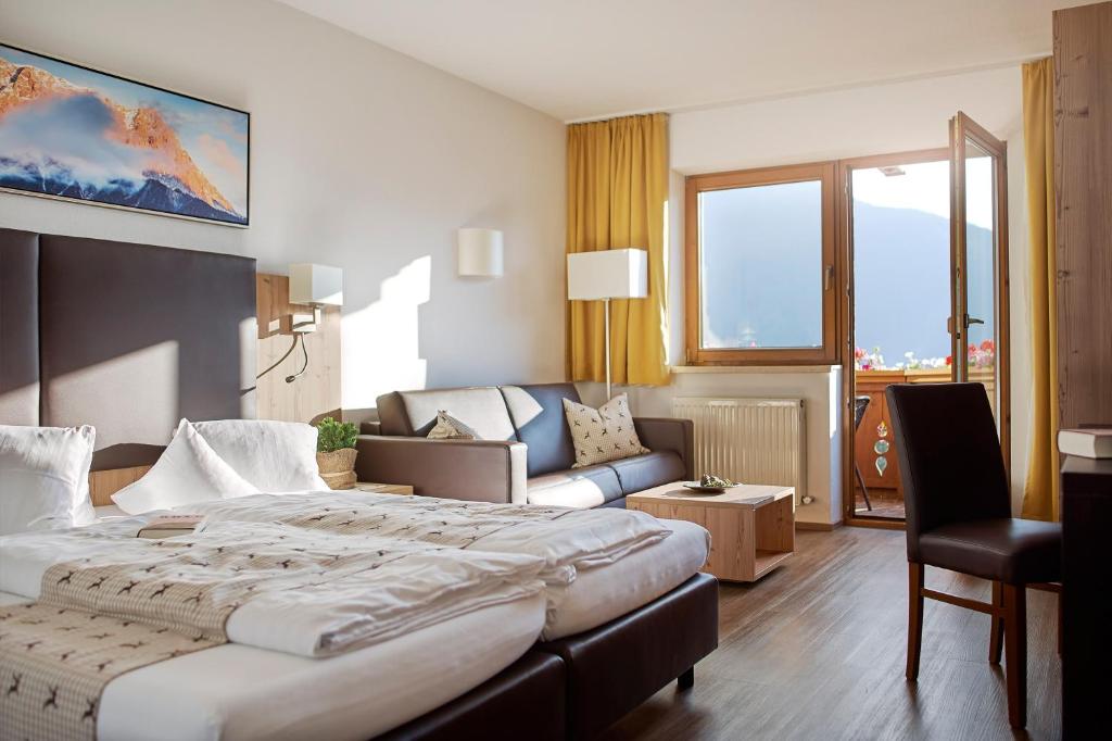 Postel nebo postele na pokoji v ubytování Hotel Venetblick