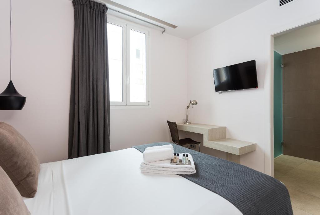 Televízia a/alebo spoločenská miestnosť v ubytovaní Quartprimera Apartments