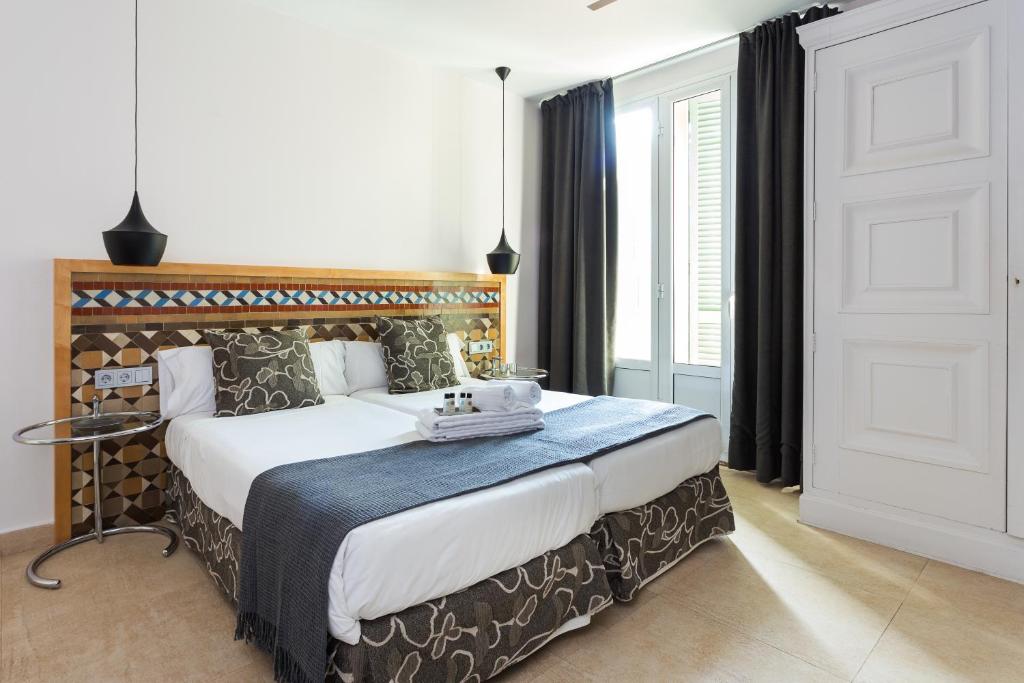 Posteľ alebo postele v izbe v ubytovaní Quartprimera Apartments