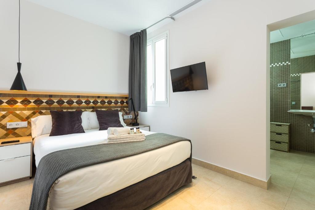 Televízia a/alebo spoločenská miestnosť v ubytovaní Quartprimera Apartments